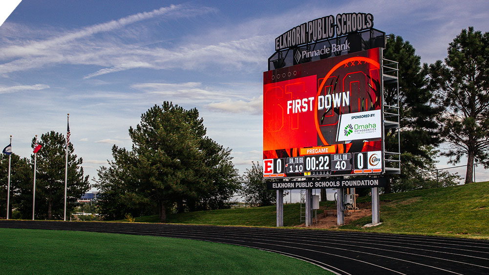 oW3426 Football LED Video Scoreboard at Elkhorn High School Stadium with Sponsored First Down Animation