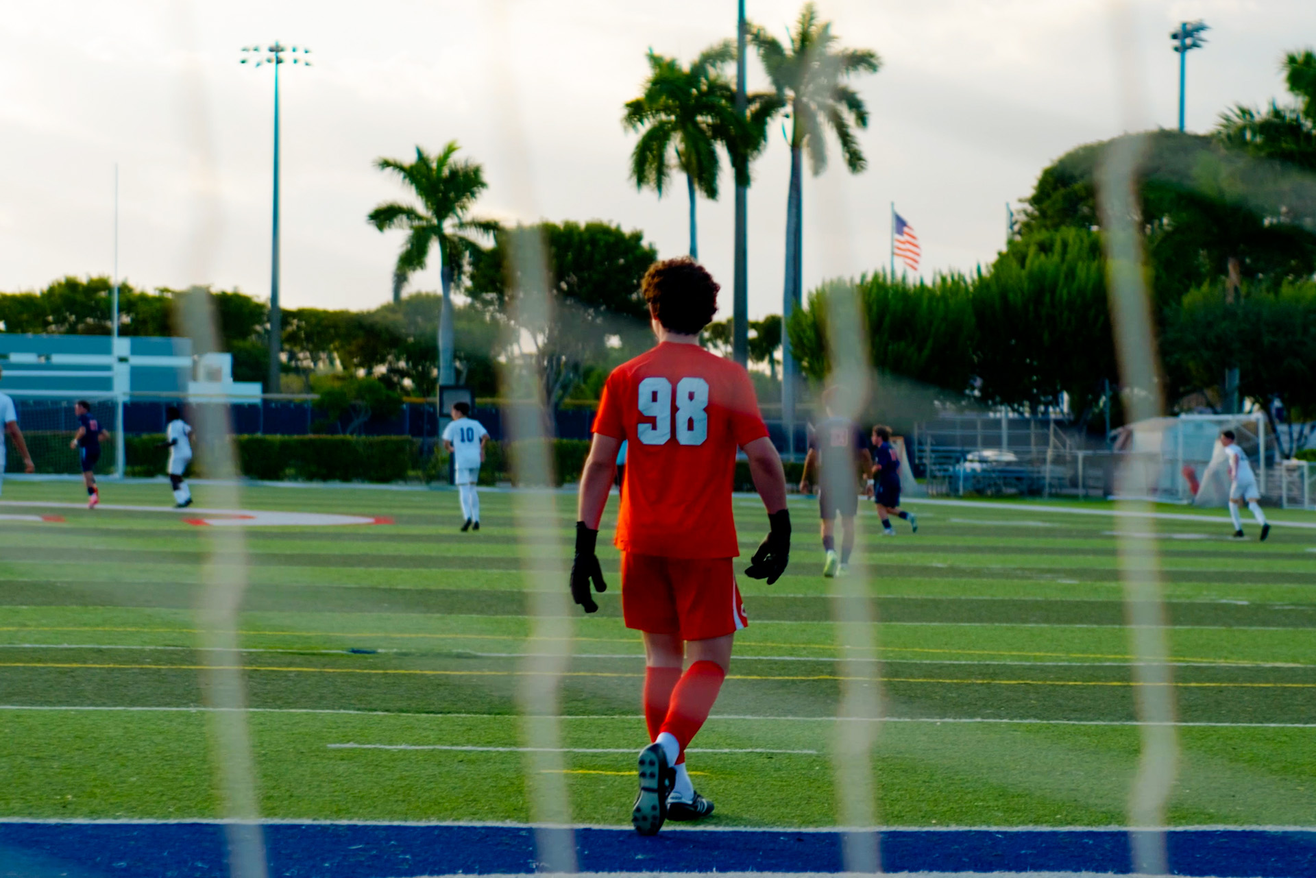 A Christopher Columbus goalkeeper takes the field under the South Florida sky.
