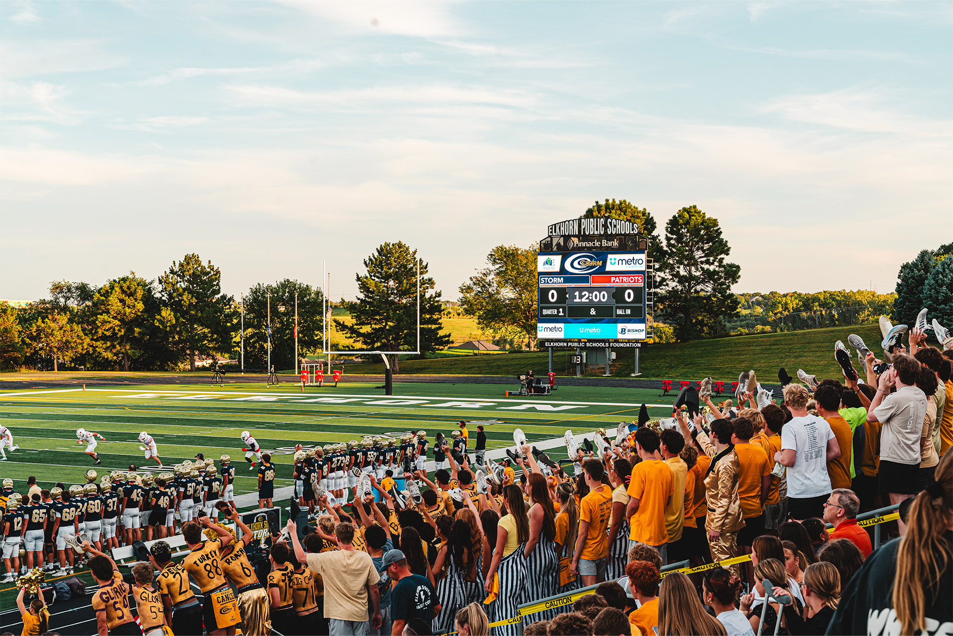 The Elkhorn South community fills the stands as the ScoreVision display anchors the game-day experience.