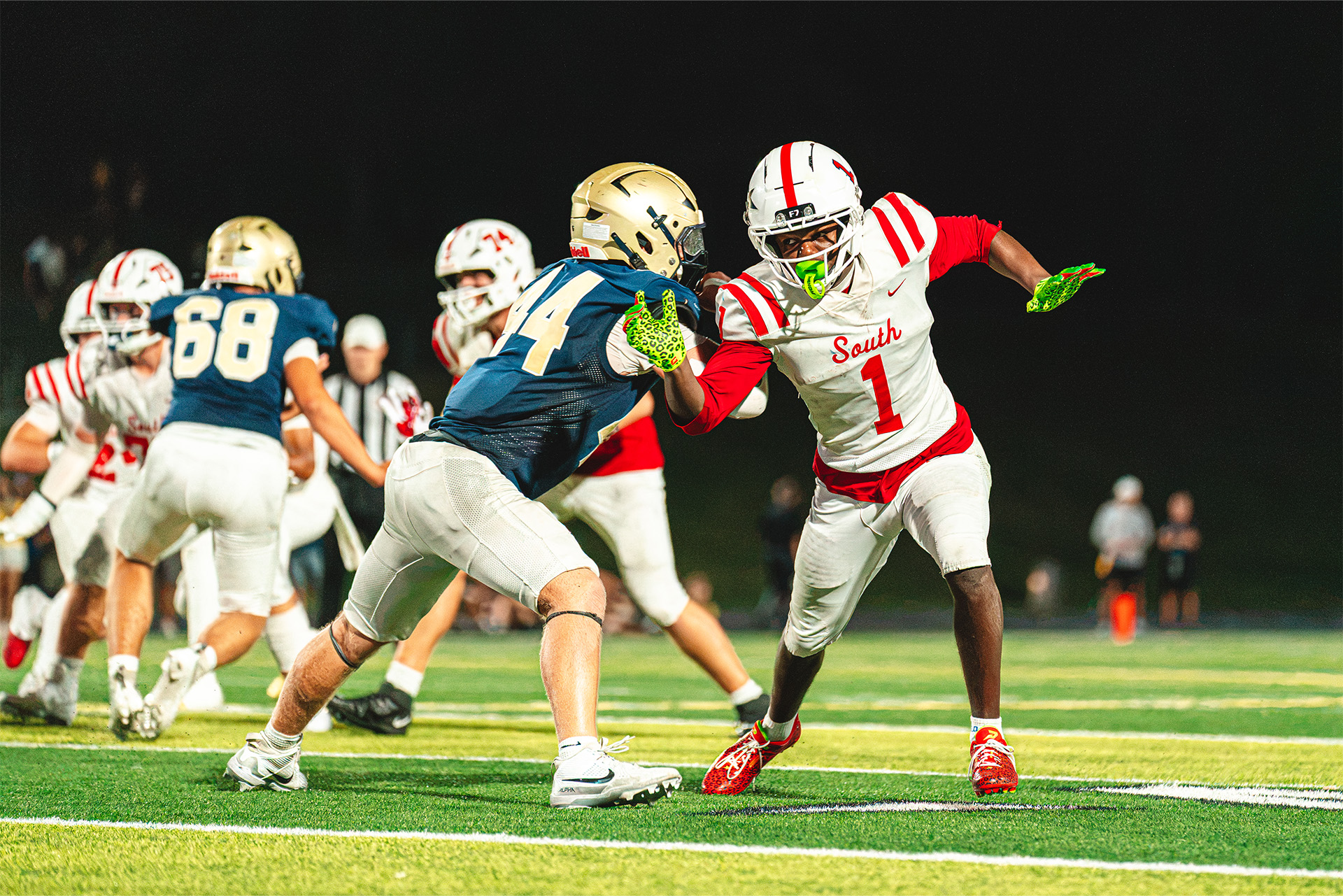 The Storm quarterback keeps the play moving behind a strong block.
