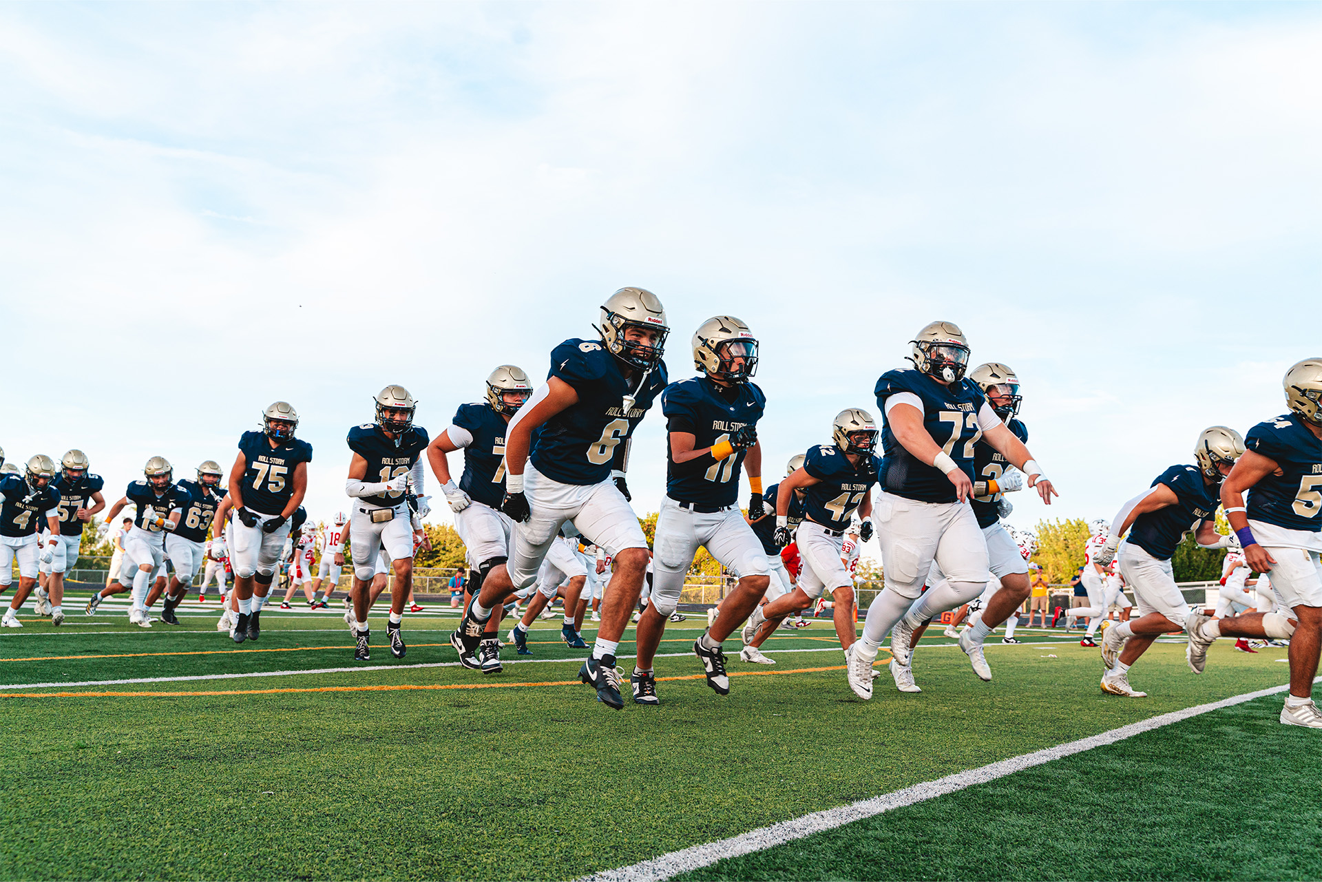 An Elkhorn South receiver secures the ball and turns upfield.