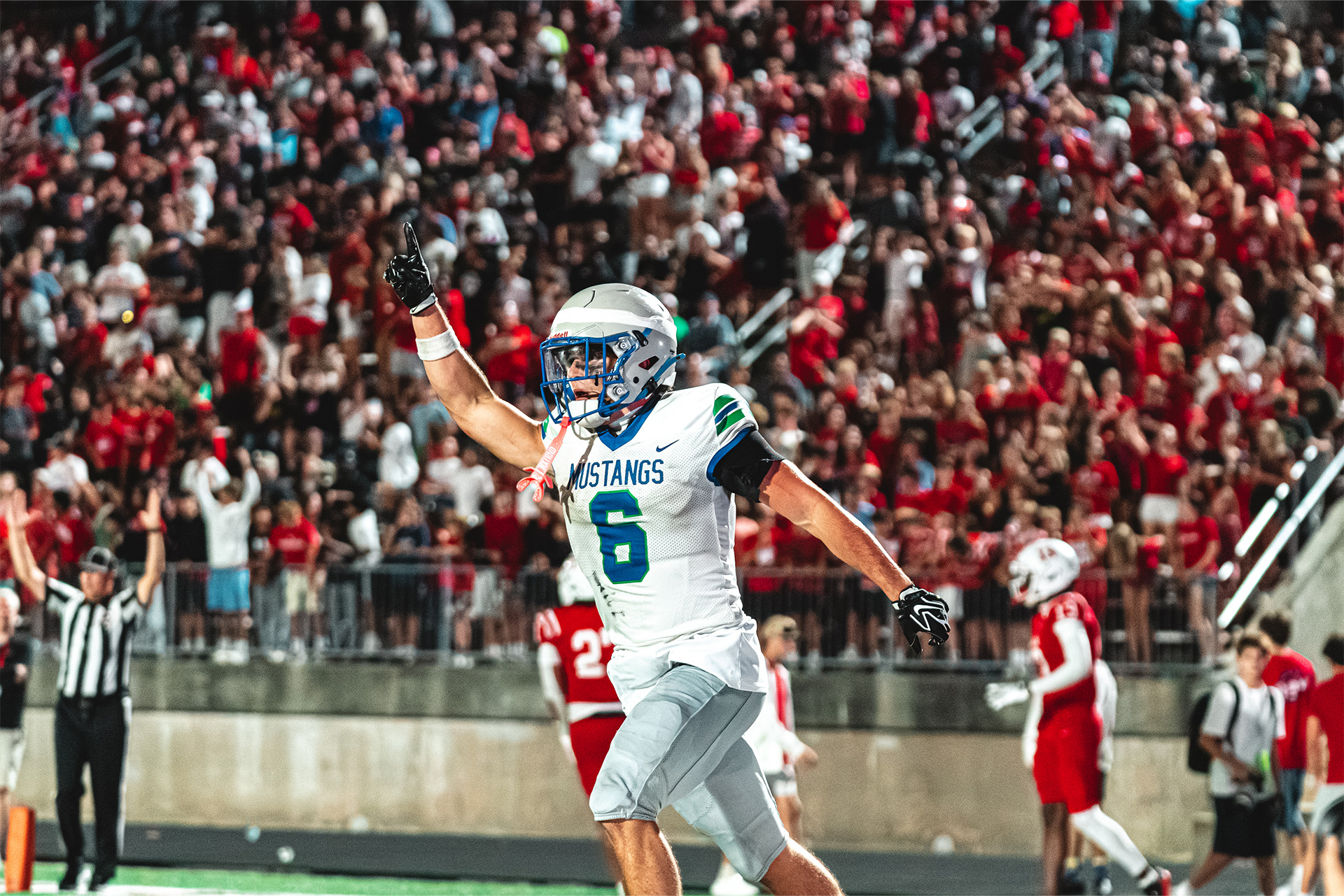 A rivalry-game touchdown ignites the packed Millard South student section.