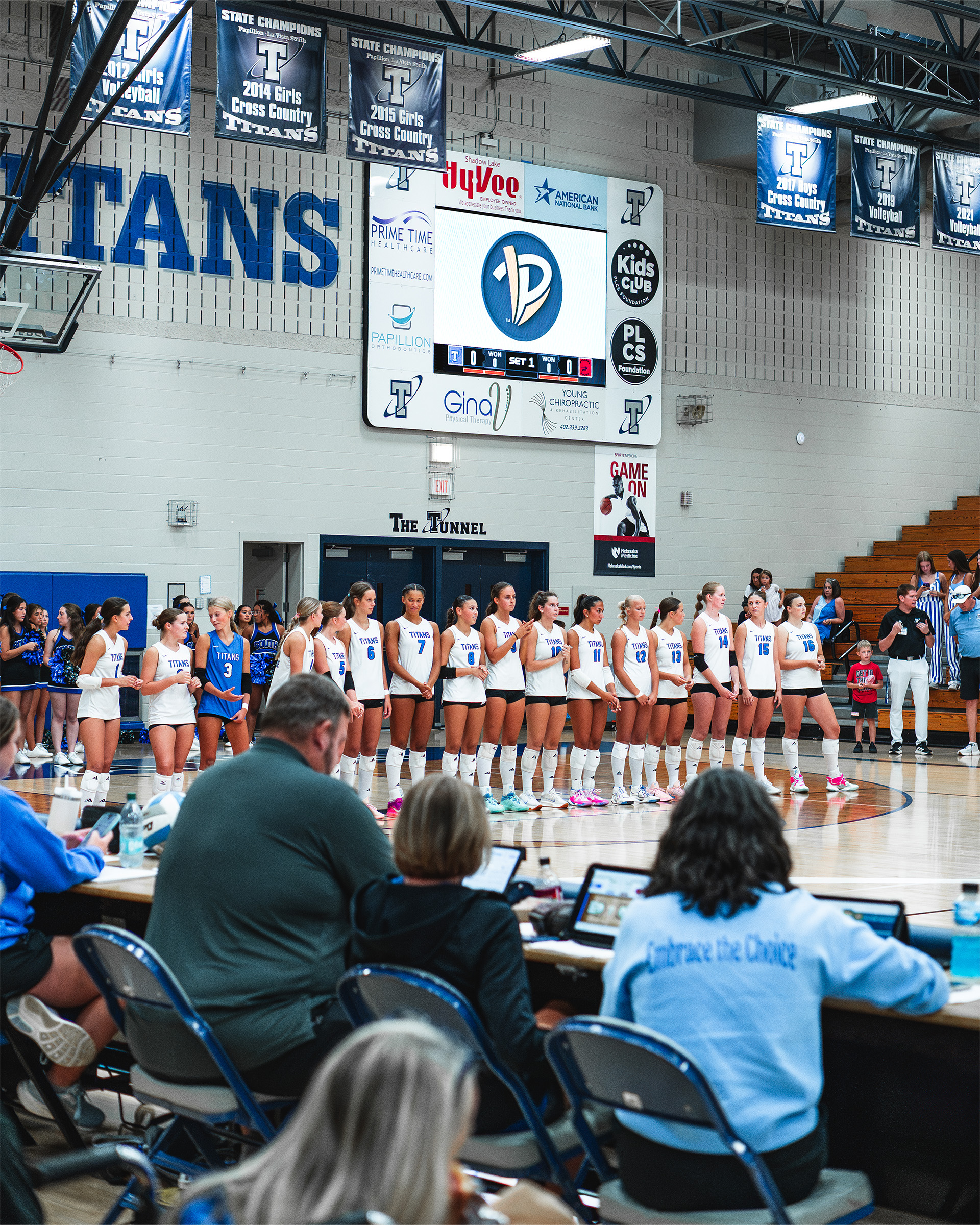 The Titans take the court beneath their ScoreVision display for pregame introductions.