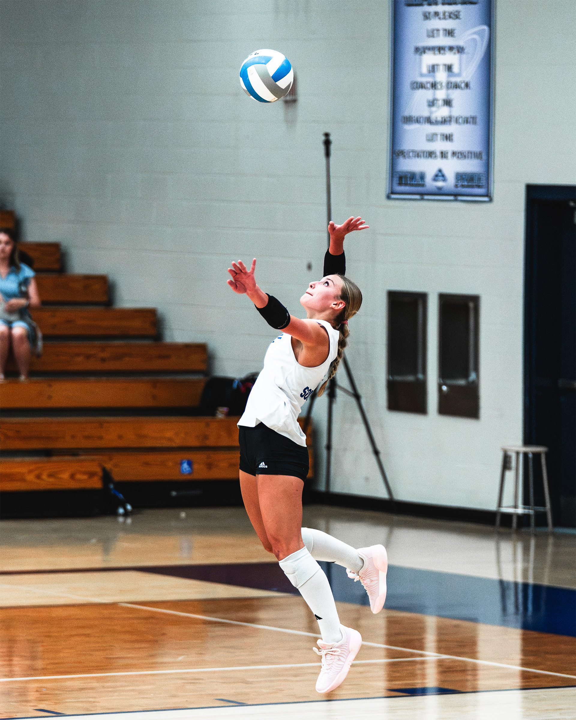 A Papillion-La Vista South player launches a powerful jump serve.