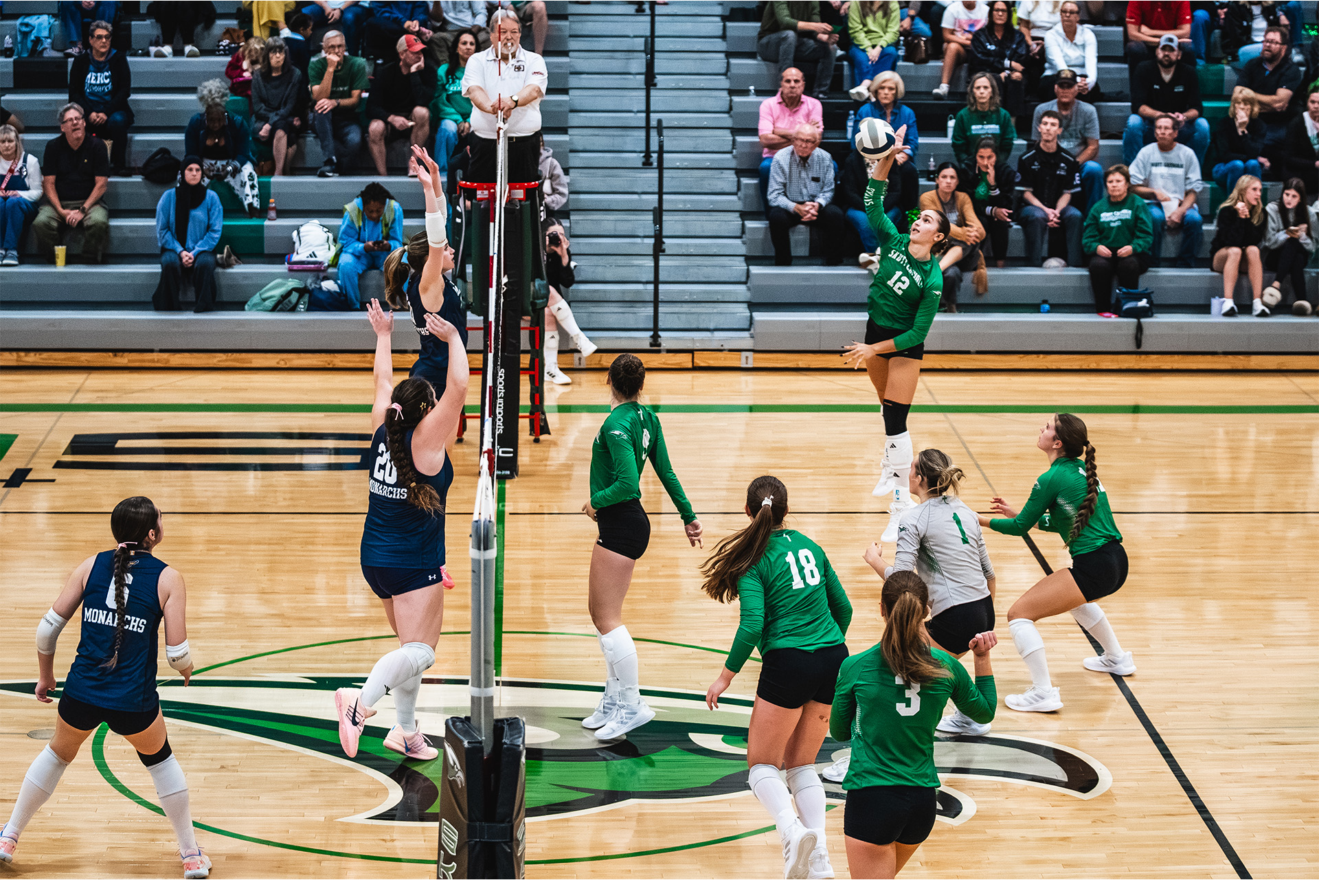 A Skutt Catholic hitter goes up for an attack in front of the home crowd.