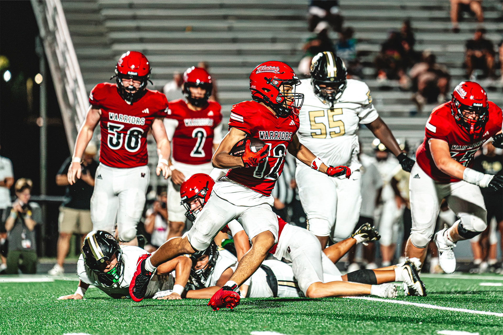 A Westside runner breaks free from a crowd of defenders.