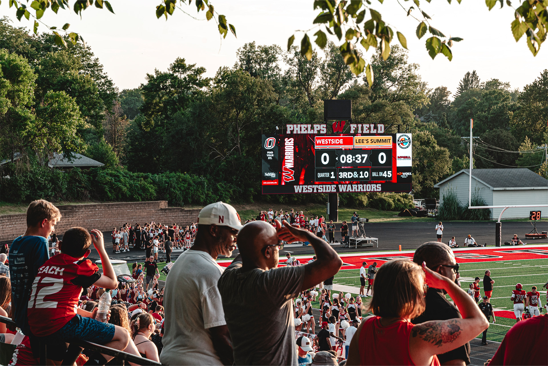 Westside fans follow the action on a ScoreVision display featuring live scoring, team branding, and local sponsors.