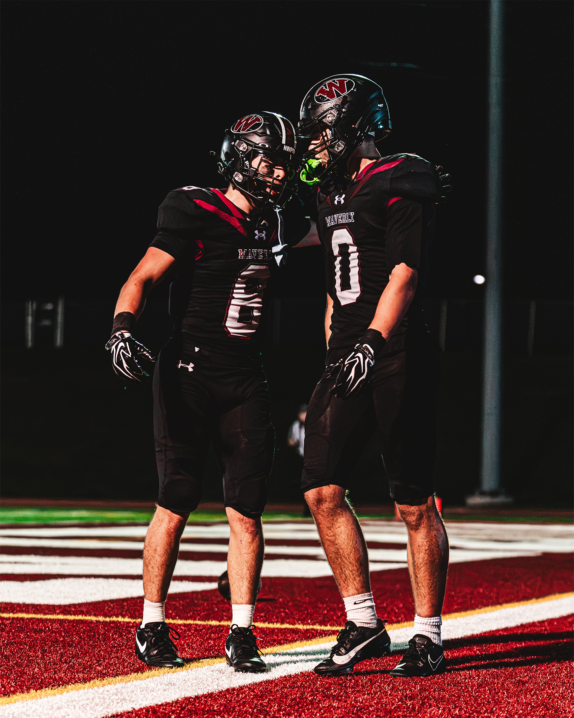 Waverly teammates share a moment of celebration in the end zone.